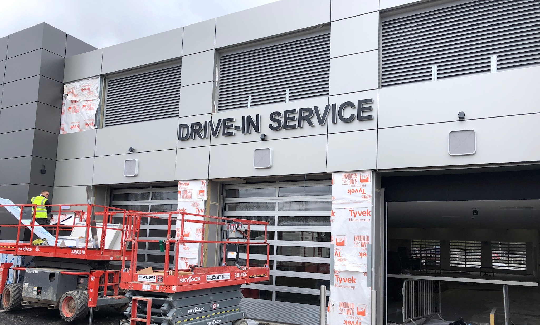 A modern drive-in garage equipped with an automatic door system for secure and convenient vehicle access in a Coventry property.