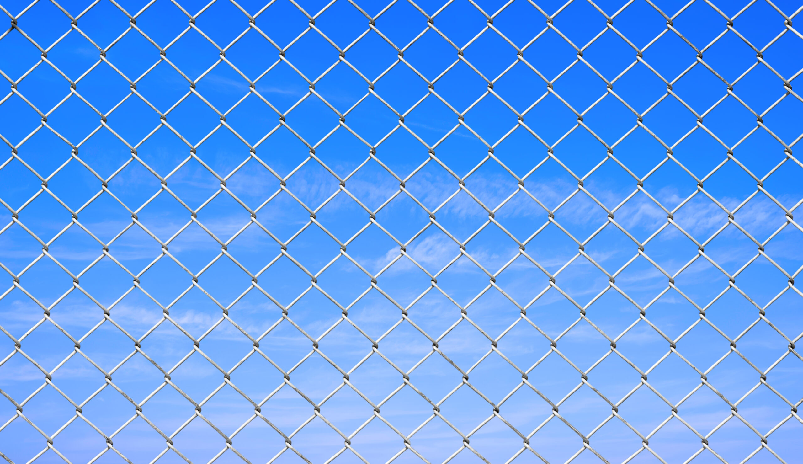 High-performance impact-dampening ball stop fencing designed to absorb energy and reduce noise in a Coventry sports facility.