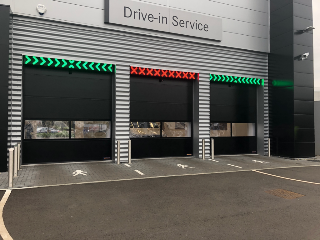 Professional installation of a dedicated long-range ANPR camera unit integrated with access control for automated vehicle entry and license plate recognition in a commercial garage.