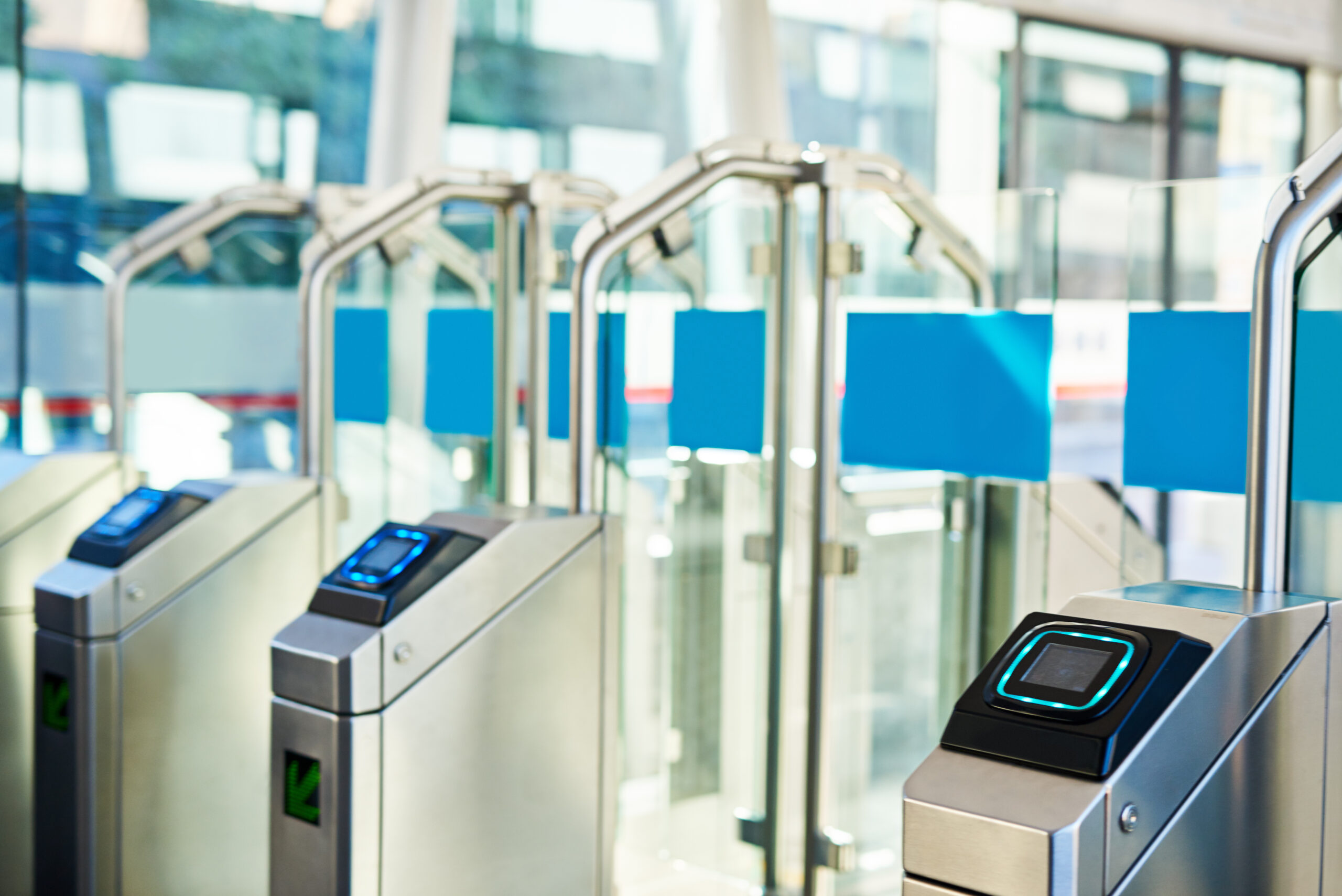 High-security glass speed gates installed by Currant Live, featuring anti-tailgating technology and a sleek design for corporate offices in Coventry.