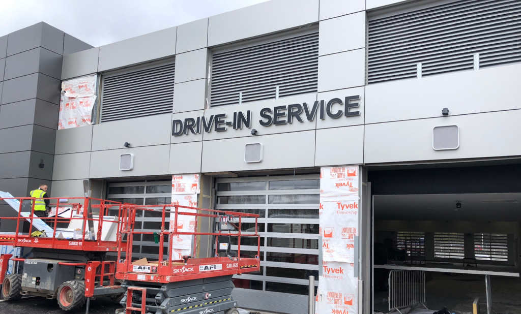 A modern drive-in garage equipped with an automatic door system for secure and convenient vehicle access in a Coventry property.