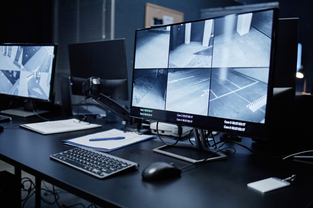 A high-tech security monitoring center showing real-time CCTV surveillance feeds for immediate incident response.