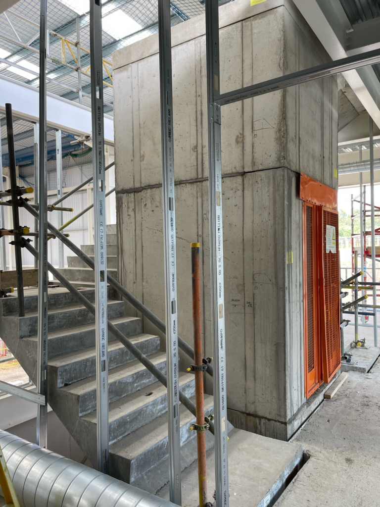 Timber-clad steel frame bin store by Currant Live, combining aesthetic design with high-security protection for commercial premises.